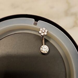 Navel Ring with beautiful white CZ stones in a stainless steel bezel setting